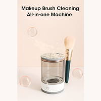 Makeup brush cleaning all-in-one machine with transparent container, silicone lid, and power button, shown with a makeup brush and water splash effect, highlighting deep cleaning capability.