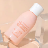 Briselle makeup brush cleansing gel bottle on beige background