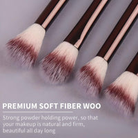 Briselle premium soft fiber makeup brushes with fluffy bristles and rose gold handles on gray background