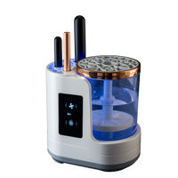 Electric makeup brush cleaner and dryer machine with water tank and smart touch panel for professional brush cleaning.